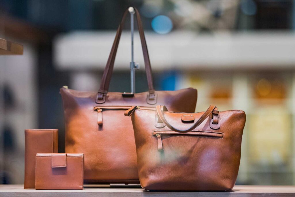 Designer leather handbags displayed in a pawn shop in Pleasant Hill, CA
